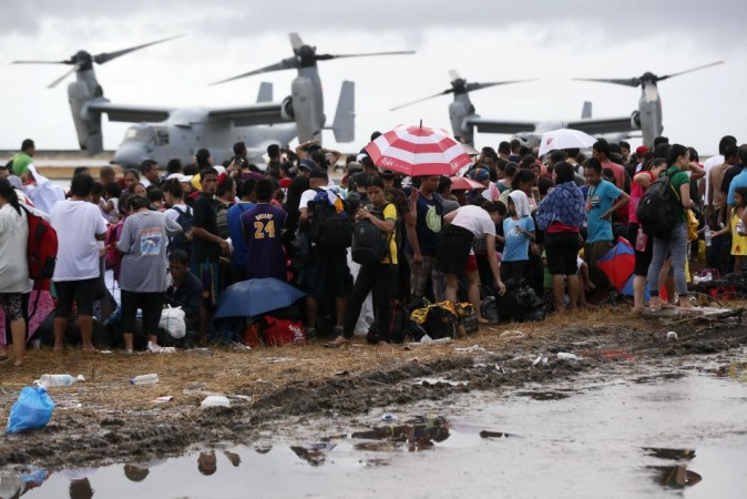 People wait to be airlifted to Manila in the aftermath of super typhoon Haiyan at Tacloban Typhoon Haiyan