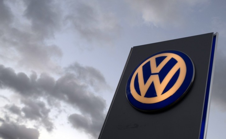 The logo of German carmaker Volkswagen is seen at a VW dealership in Hamburg, October 28, 2013. Volkswagen is due to present company results on Wednesday. REUTERS/Fabian Bimmer