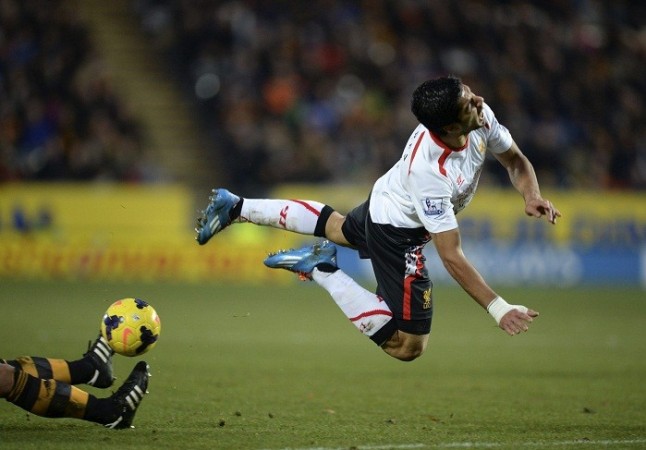 Liverpool forward Luis Suarez is sent tumbling during the English Premier League game against Hull, December 1. Reuters Luis Suarez Liverpool