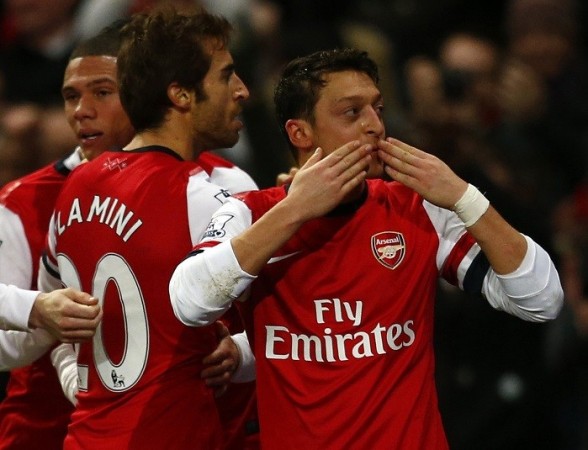 Mesut Ozil celebrates with teammates after scoring against Everton in their English Premier League game, December 8. Reuters Mesut Ozil Arsenal