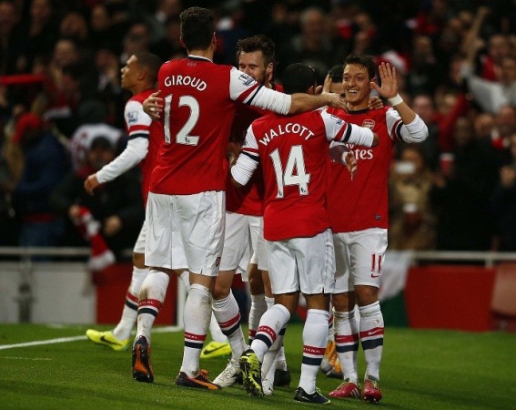 Arsenal celebrate Mesut Ozil's goal against Everton in the English Premier League, December 8. Reuters Arsenal