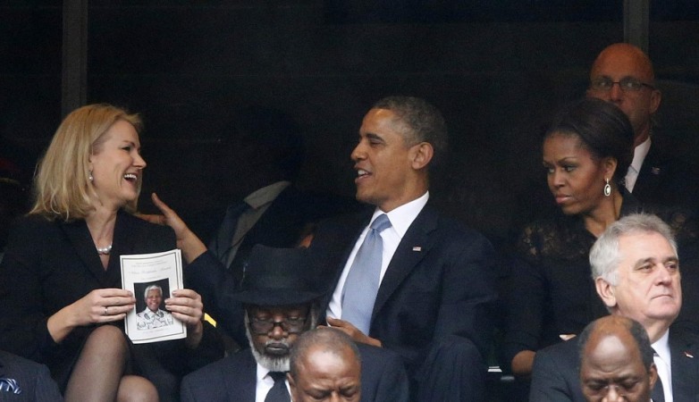 U.S. President Obama shares a moment with Denmark's PM Thorning-Schmidt during memorial service for Mandela in Johannesburg Barack Obama, Thorning Schmidt, Michelle Obama
