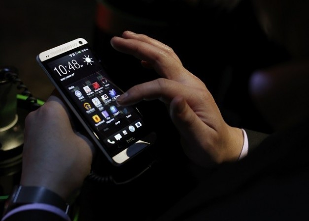 An attendee tests the new HTC One during a launch event in New York, February 19, 2013. An Attendee Tests the New HTC One During a Launch Event in New York