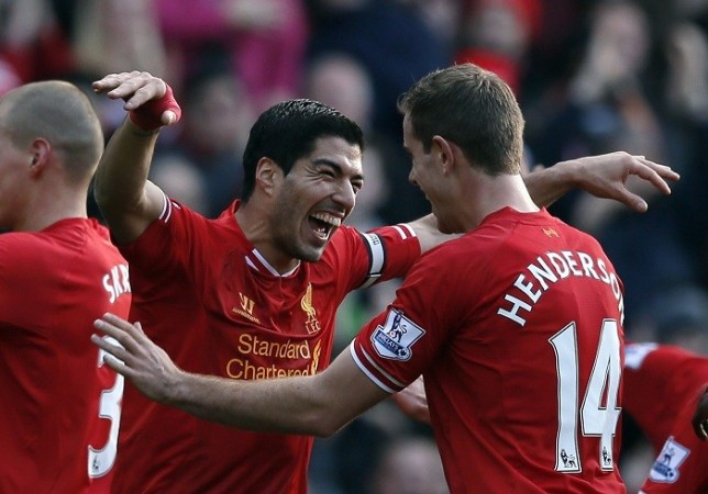 Liverpool skipper Luis Suarez celebrates with Jordan Henderson after scoring against Cardiff in the English Premier League, December 21. Reuters Luis Suarez Liverpool Jordan Henderson