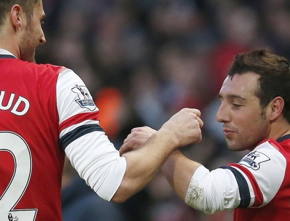 Arsenal playmaker Santi Cazorla celebrates with teammate Olivier Giroud after scoring against Fulham in the English Premier League, 18 January. Reuters Giroud Cazorla Arsenal
