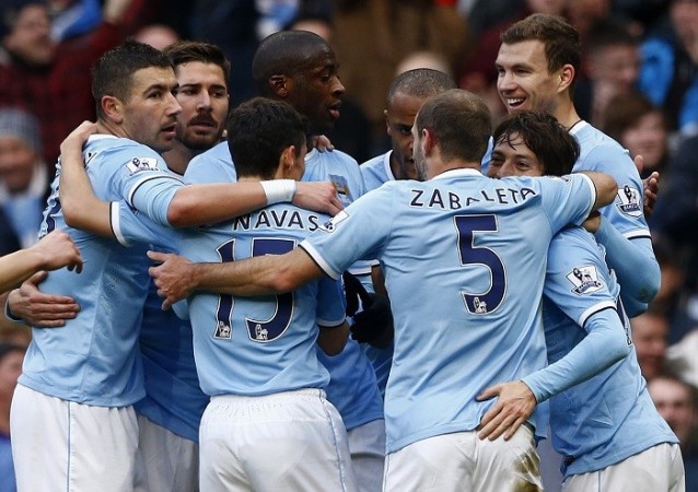 Manchester City players celebrate a goal against Cardiff in the English Premier League, 18 January. Reuters Manchester City