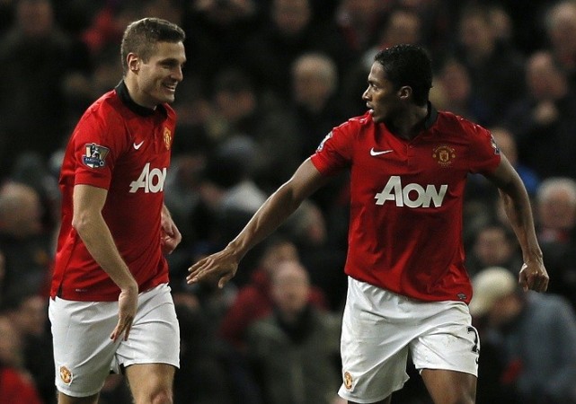 Nemanja Vidic and Antonio Valencia celebrate a goal against Swansea in the English Premier League, 11 January. Reuters Vidic Valencia Manchester United