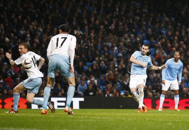 Manchester City striker Alvaro Negredo scores his third goal against West Ham in the Capital One Cup semifinal second leg, 8 January. Reuters Alvaro Negredo Manchester City West Ham