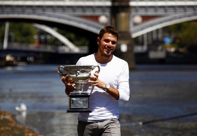 Australian Open champion Stanislas Wawrinka poses with the trophy on the banks of the Yarra river, 27 January. Reuters Stanislas Wawrinka Australian Open