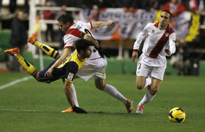 Saul Niguez brings down Diego Costa in the La Liga game on Sunday Saul Niguez brings down Diego Costa