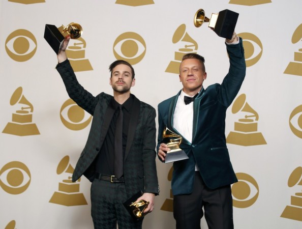 Hip hop artists Macklemore and Lewis pose backstage with their awards for Best New Artist, Best Rap Performance for Macklemore and Lewis
