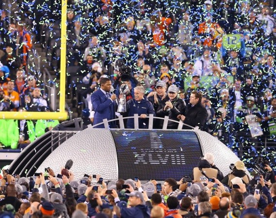 Seattle Seahawks coach Pete Carroll holds aloft the Vince Lombardi trophy after easing to victory over the Denver Broncos in Super Bowl XLVIII, 2 February. Reuters Seattle Seahawks Pete Carroll Super Bowl