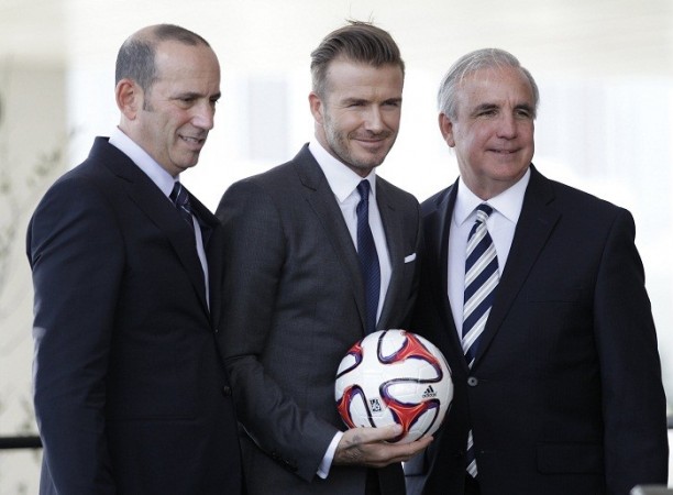 MLS commissioner Don Garber, David Beckham and Miami-Dade County Mayor Carlos Gimenez pose after a news conference in Miami, 5 January. Reuters David Beckham Carlos Gimenez Don Garber