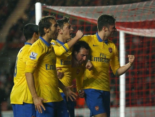 Arsenal players celebrate after scoring against Southampton in the English Premier League, 28 January. Reuters Arsenal Cazorla Ozil Flamini Giroud