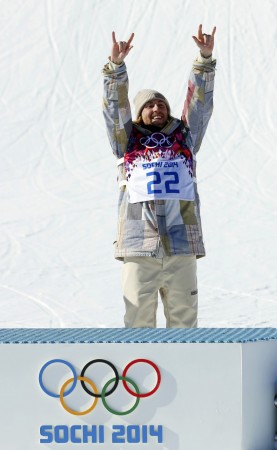 Winner of men's snowboard slopestyle competition Kotsenburg of U.S. celebrates at flower ceremony for event at 2014 Sochi Olympic Games in Rosa Khutor Sage Kotsenburg