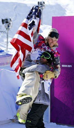 Second-placed Norway's Sandbech carries winner Kotsenburg of U.S as they celebrate after men's snowboard slopestyle final at 2014 Sochi Olympic Games in Rosa Khutor Sage Kotsenburg
