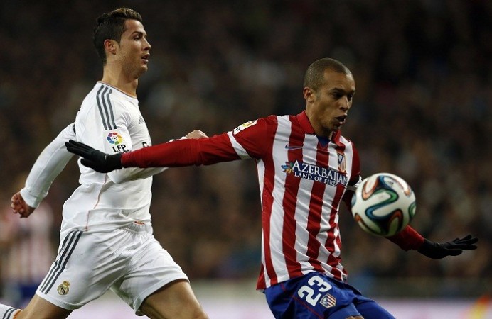 Real Madrid forward Cristiano Ronaldo and Atletico Madrid defender Miranda fight for possession during their Copa Del Rey semifinal first leg, 5 January. Reuters Ronaldo Miranda Real Madrid Atletico Madrid