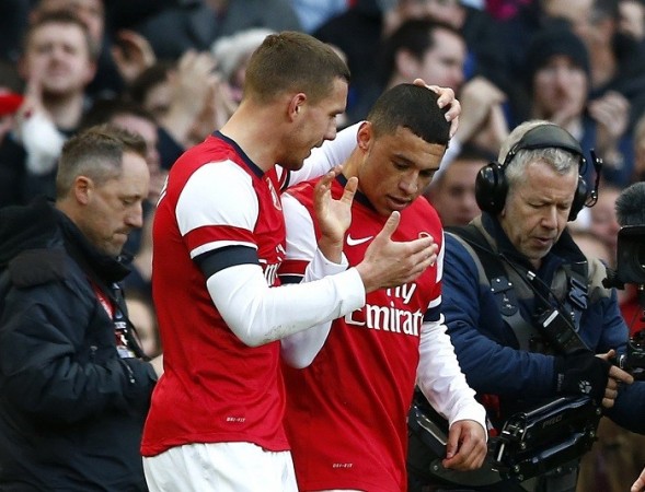 Alex Oxlade-Chamberlain celebrates with his Arsenal teammate Lukas Podolski after scoring against Liverpool in their FA Cup fifth round tie, 16 February. Reuters Alex Oxlade-Chamberlain Lukas Podolski Arsenal
