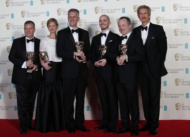 "Gravity" special visual effect team celebrates winning the category for Special Visual Effects with the film with actor Modine at the BAFTA awards ceremony in London