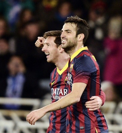 Barcelona players Lionel Messi and Cesc Fabregas celebrate a goal against Real Sociedad, 12 February. Reuters Barcelona Messi Fabregas
