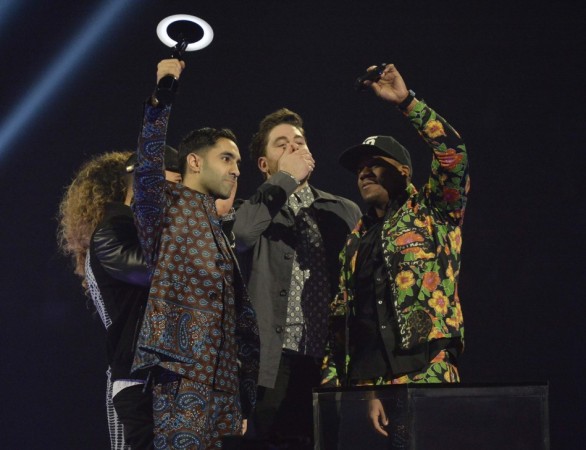 Members of Rudimental react after being presented with the British Single award at the BRIT Awards in London Rudimental