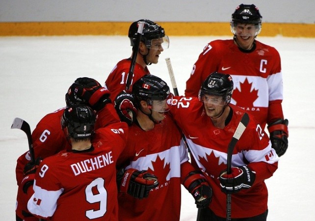 Team Canada players celebrate their win against Team USA. Reuters Ice Hockey