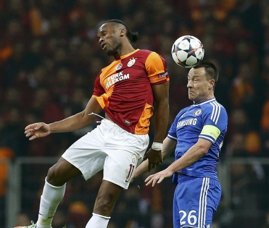 Galatasaray striker Didier Drogba and Chelsea defender John Terry fight for possession during their Champions LEague game, 26 February. Reuters Didier Drogba Galatasaray Chelsea John Terry