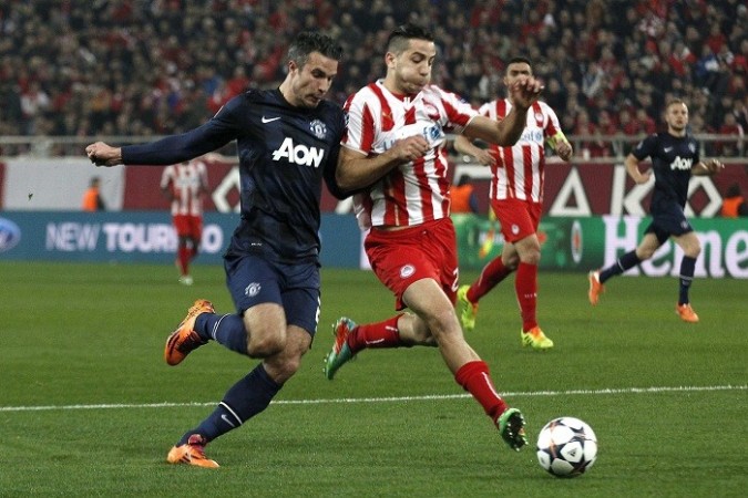 Robin Van Persie in action against Olympiakos, 25 February. Reuters Robin Van Persie Manolas Manchester United Olympiakos