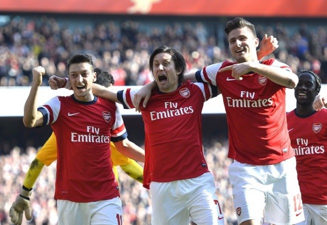 Arsenal players Mesut Ozil, Tomas Rosicky and Olivier Giroud celebrate a goal against Everton, 8 March. Reuters Ozil Rosicky Giroud Arsenal