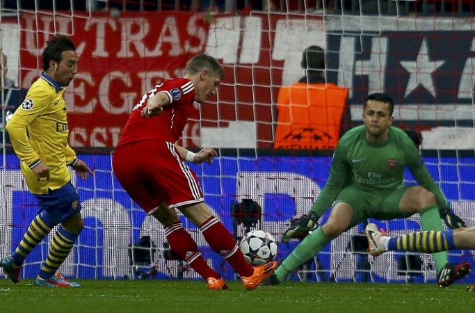 Bayern Munich midfielder Bastian Schweinsteiger scores past Arsenal goalkeeper Lukasz Fabianski in their Champions League game, 11 March. Reuters Cazorla Fabianski Schweinsteiger Arsenal Bayern Munich