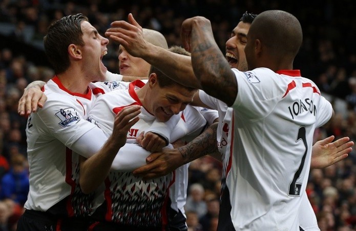 Liverpool skipper Steven Gerrard celebrates with teammates after scoring against Manchester United, 16 March. Reuters Liverpool Gerrard Suarez