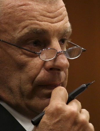 State prosecutor Gerrie Nel gestures as he cross-examines South African Olympic and Paralympic sprinter Oscar Pistorius during his trial at the North Gauteng High Court in Pretoria April 9, 2014. (Photo: Reuters)