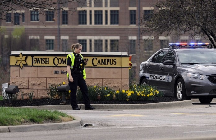 A police officer guards the entrance to the scene of a shooting at the Jewish Community Center of Greater Kansas City in Overland Park, Kansas. Who is Frazier Glenn Miller? (Photo: Reuters) Jewish Community Center Shooting