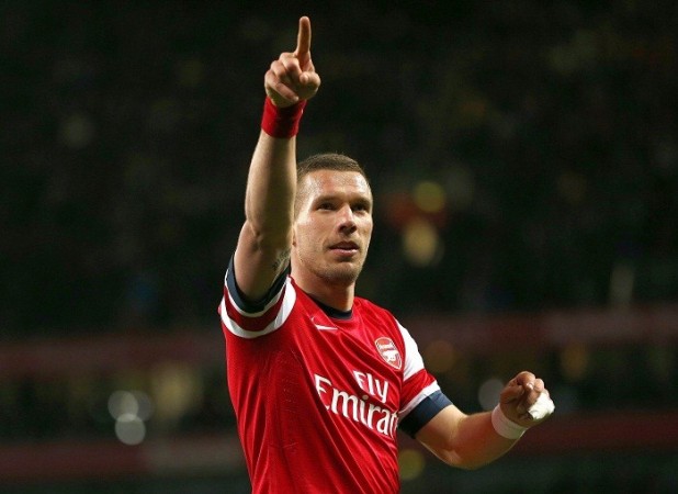 Arsenal forward Lukas Podolski celebrates after scoring against West Ham in the English Premier League Lukas Podolski Arsenal