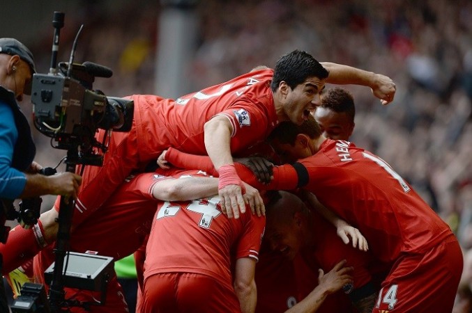 Liverpool players celebrate a goal against Manchester City in the English Premier League, 13 April. Reuters Luis Suarez Liverpool