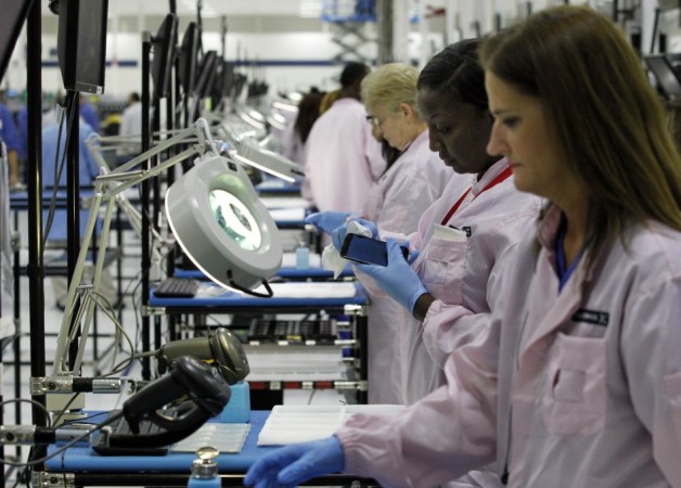 Workers assemble Motorola phones at the Flextronics plant that will be building the new Motorola smart phone Motorola Moto E Release Date in a Week? Rumoured Specifications