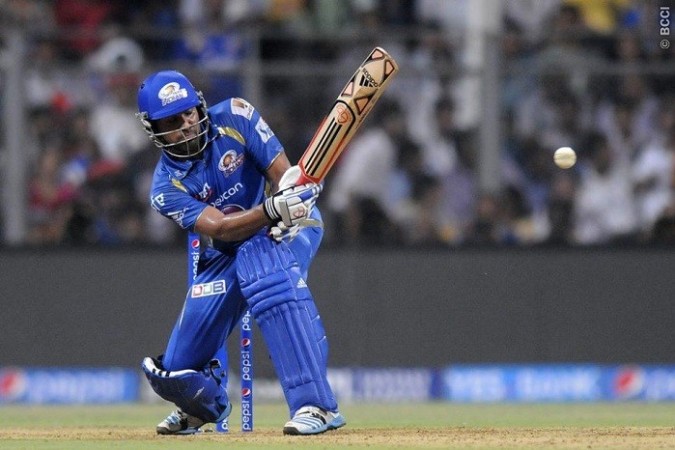 Mumbai Indians skipper Rohit Sharma hits a boundary in the IPL 2014 game against the Royal Challengers Bangalore, 6 May. Pal Pillai/IPL/SPORTZPICS Rohit Sharma Mumbai Indians