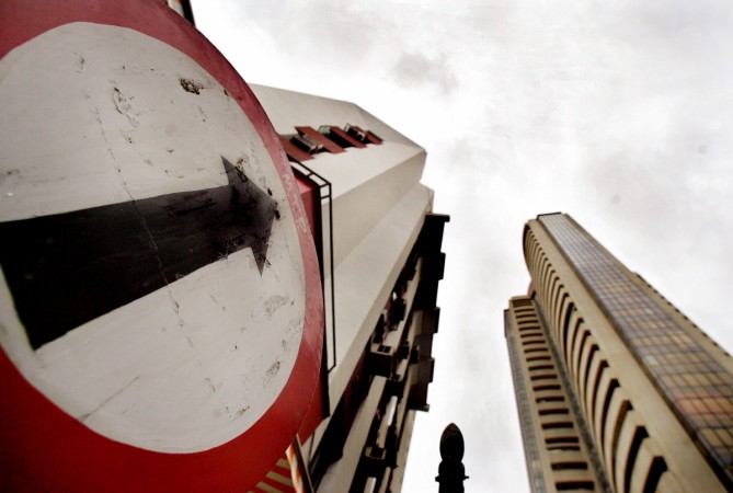 A road sign stands next to the Bombay Stock Exchange building (Reuters)
