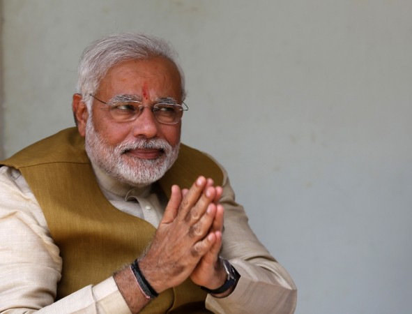 Hindu nationalist Narendra Modi, the prime ministerial candidate for Bharatiya Janata Party, gestures after seeking blessings from his mother Heeraben in Gandhinagar