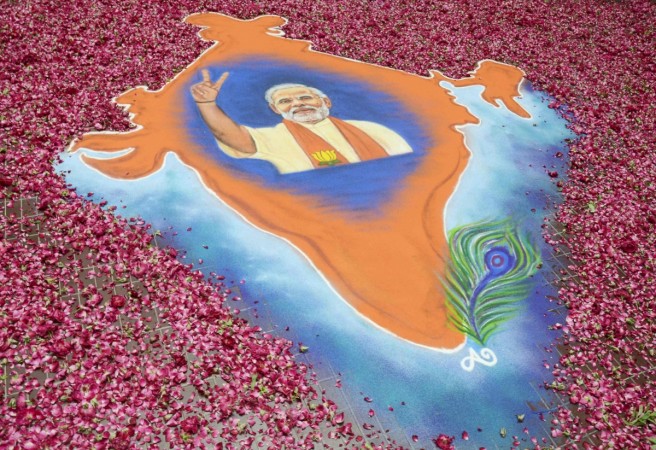 A rangoli showing a map of India with an image of Modi, prime ministerial candidate for BJP, is pictured in the premises of the party's regional office in the western Indian city of Ahmedabad