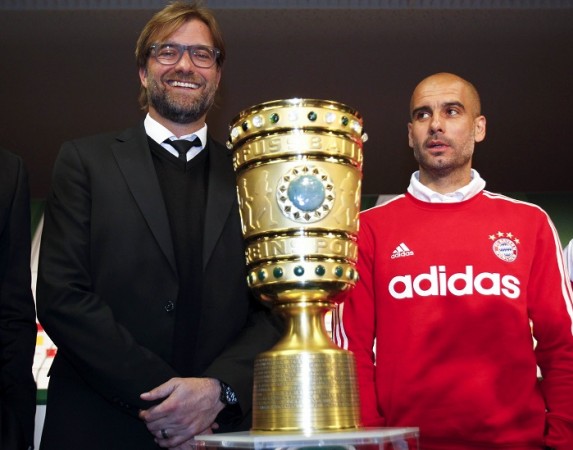 Borussia Dortmund manager Jurgen Klopp and Bayern Munich boss Pep Guardiola pose with the German Cup trophy, 16 May Guardiola Bayern Munich Klopp Borussia Dortmund