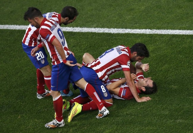 Diego Godin celebrates with his Atletico Madrid teammates after scoring the opening goal against Real Madrid, 24 May Diego Godin Atletico Madrid