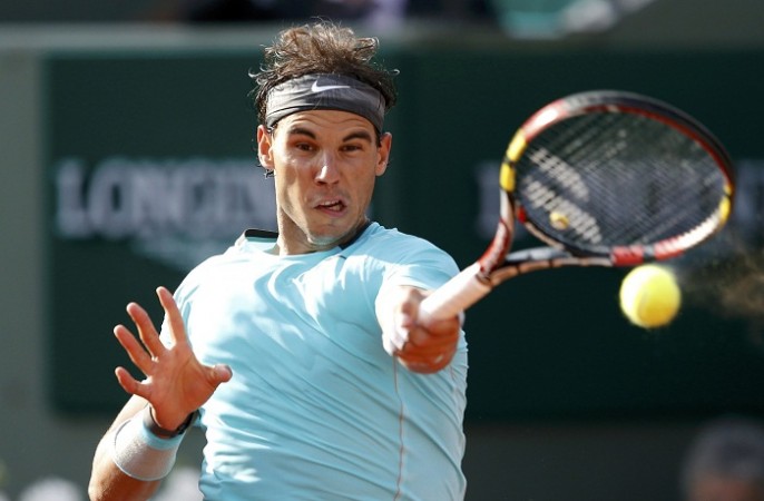 Rafael Nadal returns the ball to Robby Ginepri during their match at the French Open. Rafael Nadal French Open