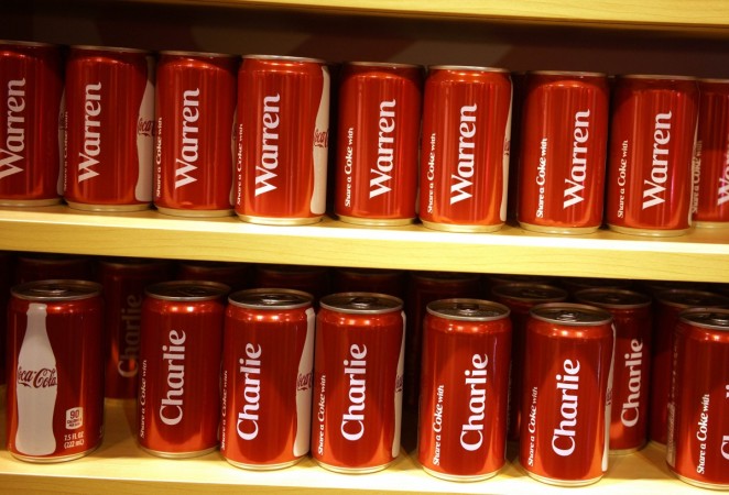 Commemorative Coca-Cola cans featuring the names of Berkshire Hathaway CEO Warren Buffett and vice-chairman Charles Munger are seen at the exhibition of Berkshire Hathaway companies at the annual meeting in Omaha. Coca Cola