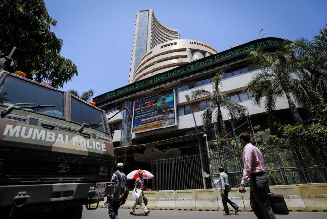 People walk past the BSE building in Mumbai