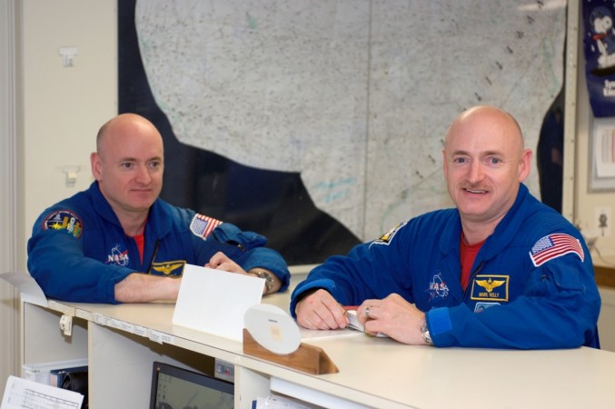 Astronauts Mark Kelly (right), STS-124 commander, and Scott Kelly are pictured in the check-out facility at Ellington Field near NASA's Johnson Space Center as the STS-124 crewmembers prepare for a flight to Kennedy Space Center in NASA T-38 trainer jets.
