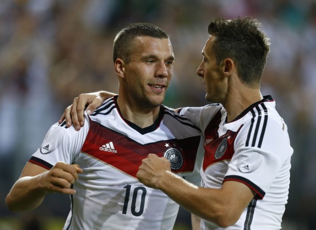 Germany's Podolski and Klose celebrate Podolski's goal during their friendly soccer match against Armenia in Mainz Lukas Posolski and Miroslav Klose