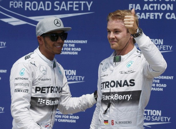 Mercedes' drivers Nico Rosberg and Lewis Hamilton react after qualifying. Lewis Hamilton Nico Rosberg Mercedes