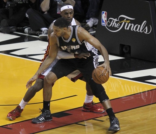 San Antonio Spurs' Tim Duncan drives on Miami Heat's LeBron James in the NBA Final. Tim Duncan San Antonio