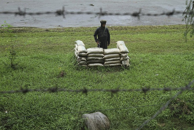 An Indian army soldier stands guard close to the Line of Control, a ceasefire line dividing Kashmir between India and Pakistan, in Poonch district. An Indian army soldier stands guard close to the Line of Control, a ceasefire line dividing Kashmir between India and Pakistan, in Poonch